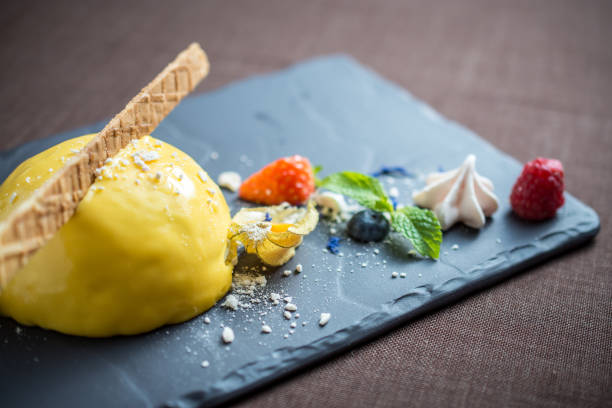 istock Ice cream with yellow lemon glaze and berries 1224902781