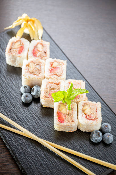 istock Sweet sushi rolls, strawberries, banana, chocolate 1224916275