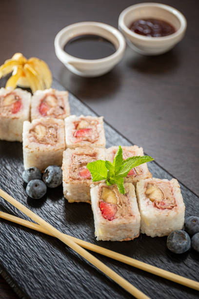 istock Sweet sushi rolls, strawberries, banana, chocolate 1224916322
