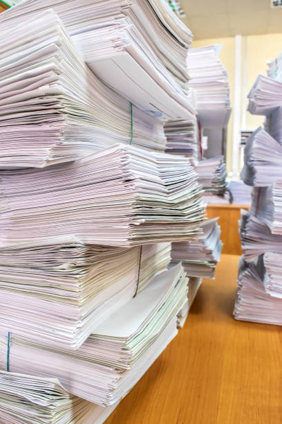 pile of paper documents in the office stock photo