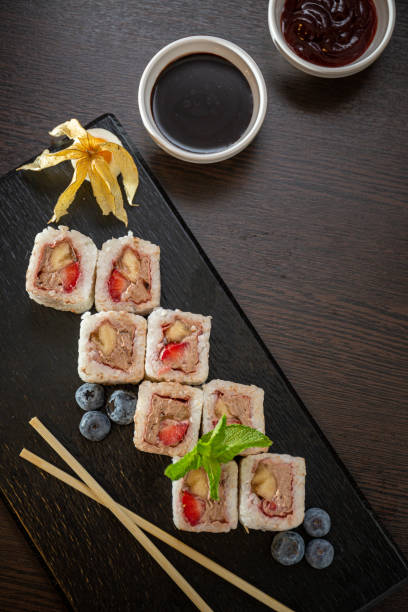 istock Sweet sushi rolls, strawberries, banana, chocolate 1224918644