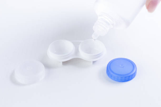 istock Liquid for lenses is poured into the boxes. Ophthalmology concept. White background. 1224919081