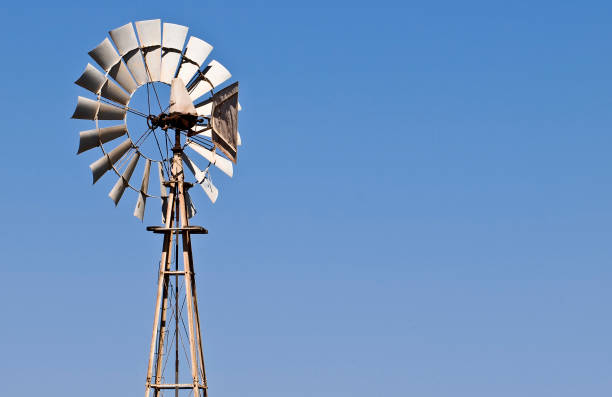 istock Old agricultural wind Mill over blue sky 1224923804