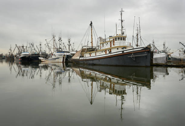 Calm water and clouds over the harbor of Steveston, British Columbia, Canada near Vancouver. Steveston is a small fishing village on the banks of the Fraser River.