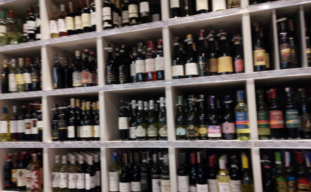 istock Concept blurred image. Alcohol showcase blurred background. Blurred abstract background of shelf in supermarket 1224926454