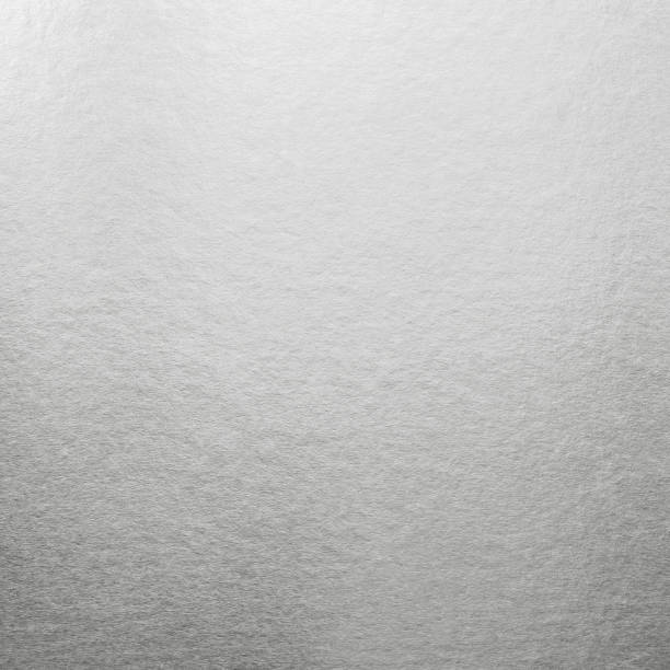 istock Silver background metallic texture white wrapping foil paper shiny light grey metal backdrop for wall paper decoration element 1224927228