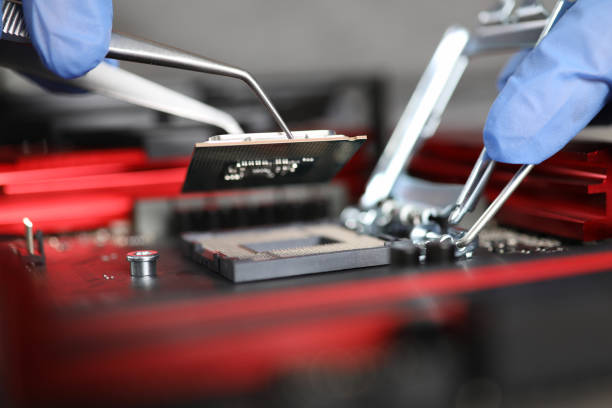 istock Close-up gloved hands repairing microchip details 1224927484