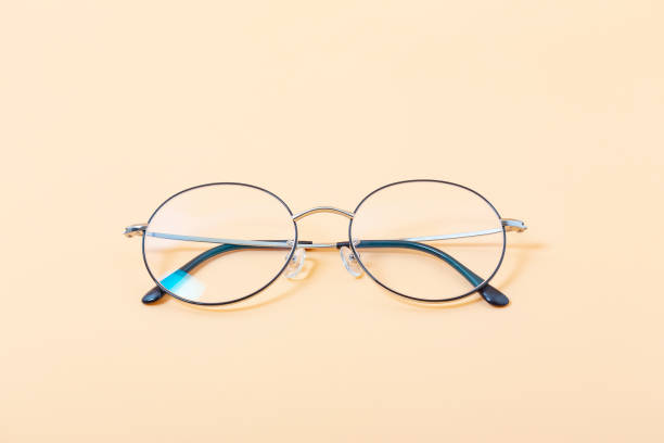 istock Gilt glasses yellow background image 1224932558