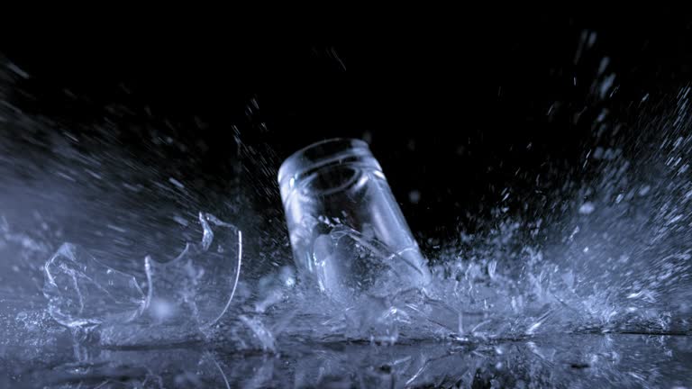 SLO MO LD Crystal glass falling onto the surface and shattering