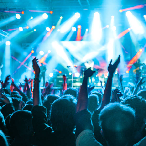 istock cheering crowd at rock concert 1224941954