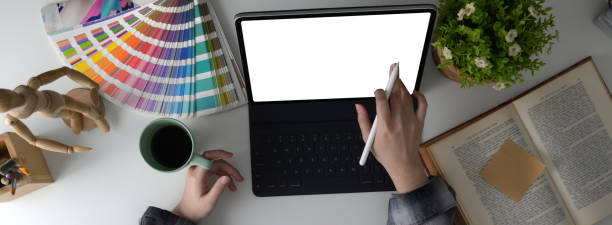 istock Overhead shot of female designer student doing her assignment with blank screen tablet 1224942212