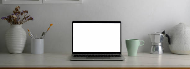 istock Close up view of trendy worktable with stationery, coffee mug and copy space 1224942245