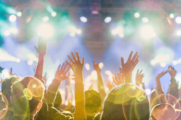 istock cheering crowd at rock concert 1224942919