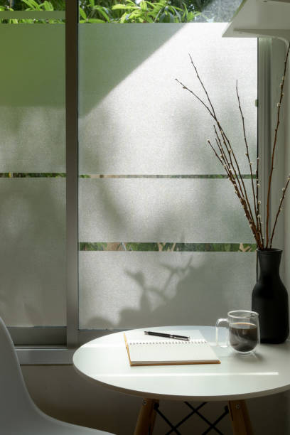 istock Cropped shot of modern home interior design with flower vase and diary notebook 1224942924