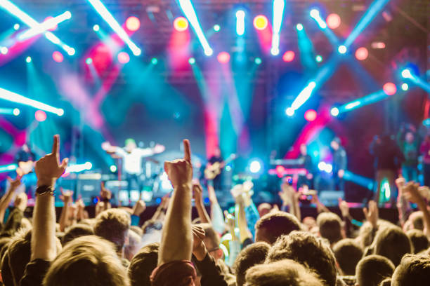 istock cheering crowd at rock concert 1224944964