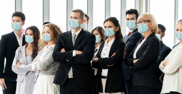 istock Confident business people with face mask protect from Coronavirus or COVID-19. 1224945765