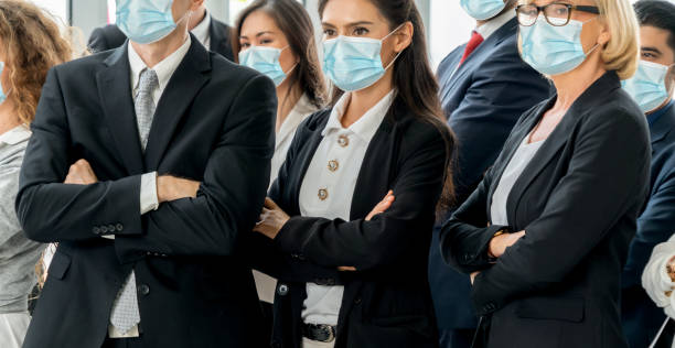 istock Confident business people with face mask protect from Coronavirus or COVID-19. 1224945773