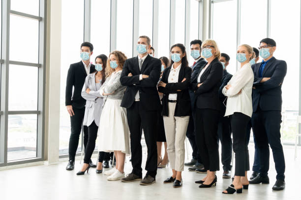 istock Confident business people with face mask protect from Coronavirus or COVID-19. 1224945774