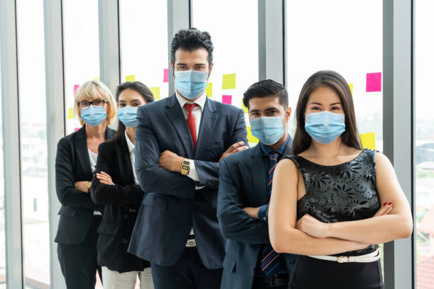 istock Confident business people with face mask protect from Coronavirus or COVID-19. 1224945803