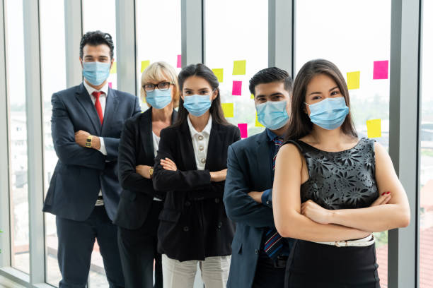 istock Confident business people with face mask protect from Coronavirus or COVID-19. 1224945814