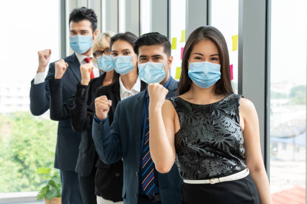 istock Confident business people with face mask protect from Coronavirus or COVID-19. 1224945834