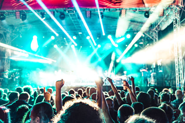 istock cheering crowd at rock concert 1224946811