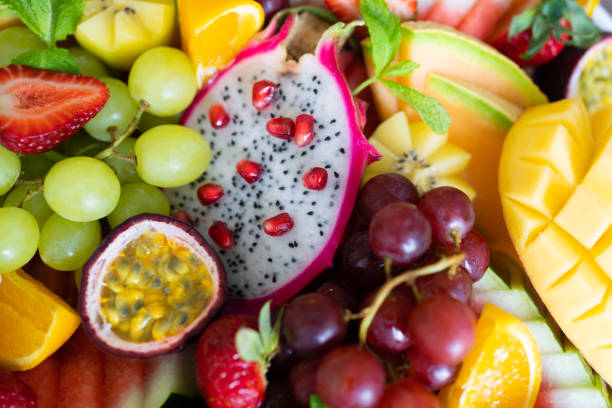istock close up sliced assorted fresh tropical fruits platter,use a background 1224947698