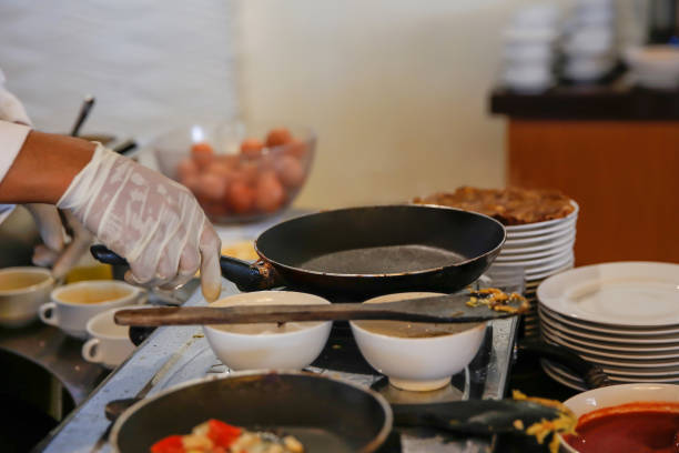 Close up shot of male chef  preparing to cook food for iftar charity meal box during Ramadan amidst Covid 19 pandemic