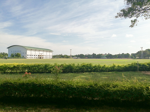 Landscape view of Jaffna university play ground in Sri lanka. Sky background.