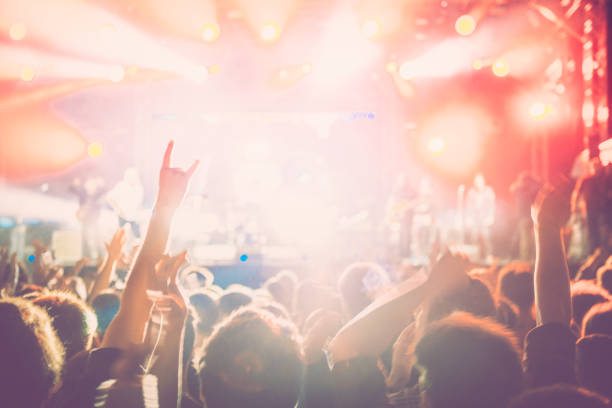 istock cheering crowd at rock concert 1224950567