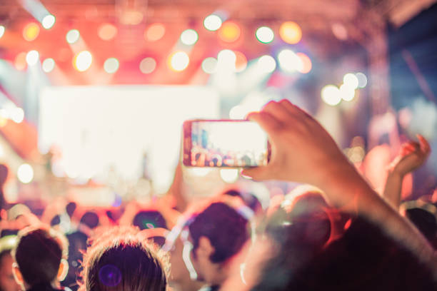 istock cheering crowd at rock concert 1224951214