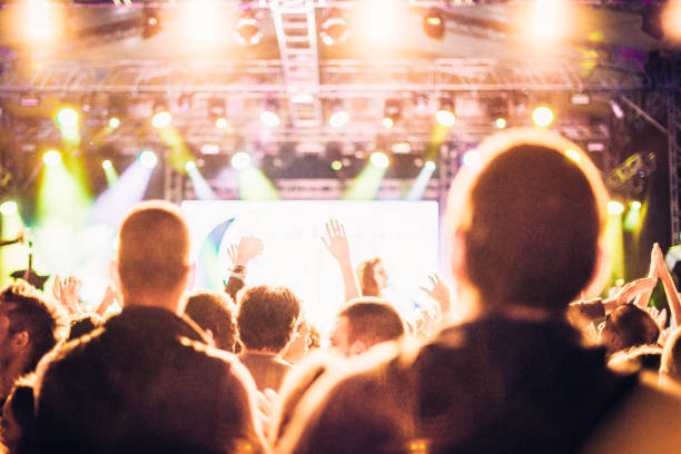 istock cheering crowd at rock concert 1224951266