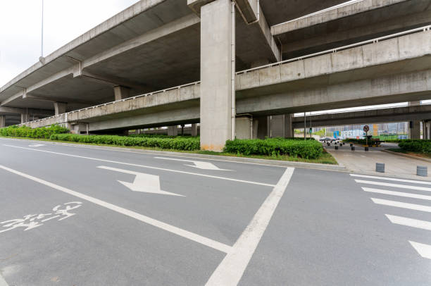 istock Concrete structure and asphalt road space under the overpass in the city 1224954067