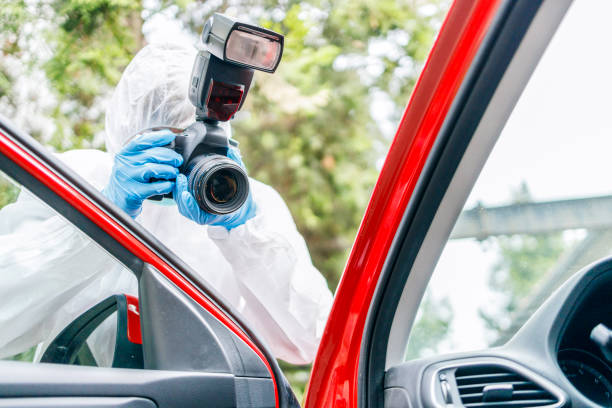 istock Forensic specialist taking photos of crime scene 1224954179