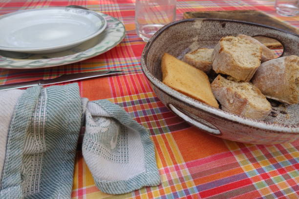 istock Sliced country bread and rusk   Ceramic basket  Set table 1224956851