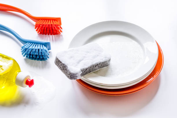 istock concept of washing dishes on white background top view 1224961103