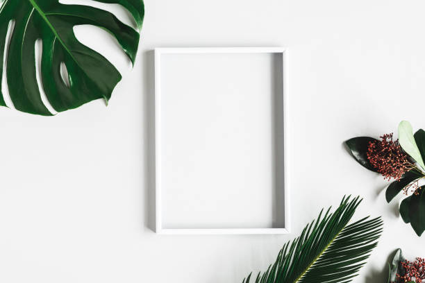 istock Summer composition. Tropical flowers and leaves, photo frame on white background. Summer concept. Flat lay, top view, copy space 1224963075