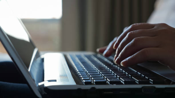 istock freelancer hands type on black laptop keyboard closeup 1224964268