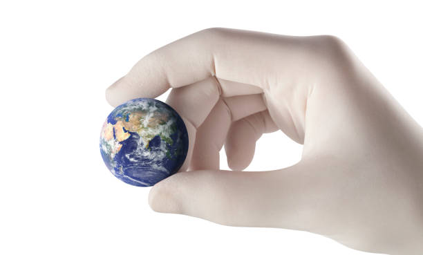 istock Pandemic concept. Hand holding the earth. 1224964675
