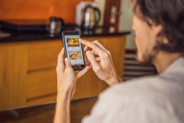 istock man orders food for lunch online using smartphone 1224965650