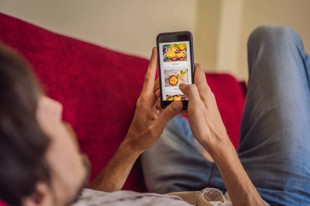 istock man orders food for lunch online using smartphone 1224965654