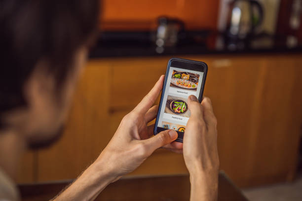 istock man orders food for lunch online using smartphone 1224965656