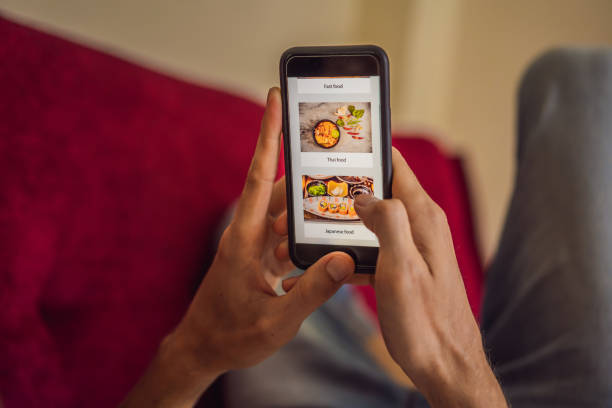 istock man orders food for lunch online using smartphone 1224965658