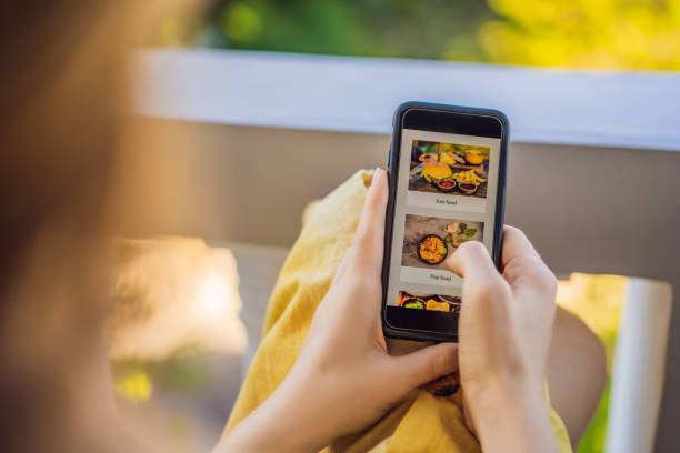 istock Young woman orders food for lunch online using a smartphone 1224965672