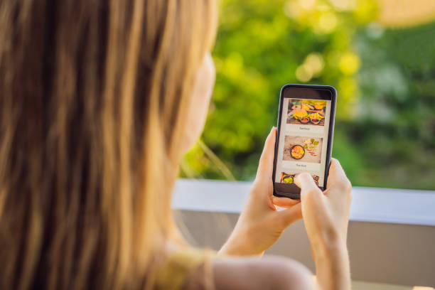 istock woman orders food for lunch online using a smartphone 1224965682