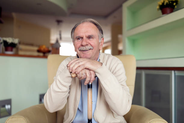 istock Lonely Senior Man is Sitting on Sofa at Home and Looking Confident. 1224966684