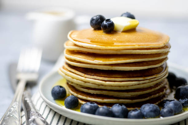 istock Sweet dessert: pancakes with berries, butter and honey 1224968019