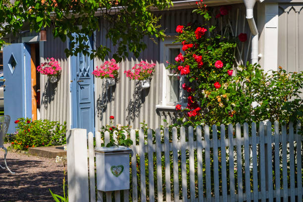 idyllic summer garden with blooming flowers and a mailbox on the fence - 5898 imagens e fotografias de stock