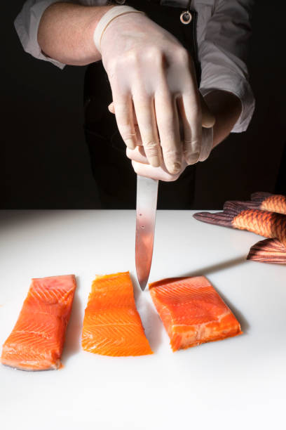 istock Chef cook with a salmon 1224975660