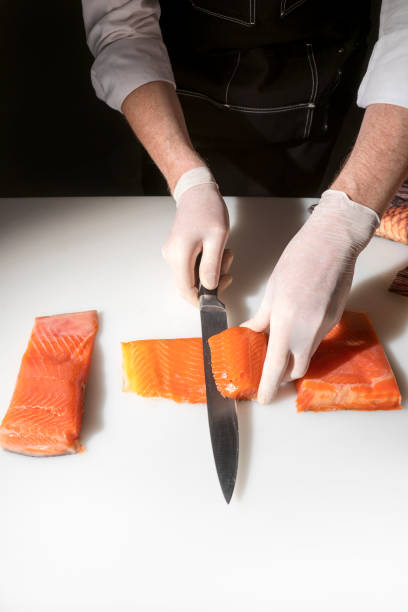 Chef cook with a salmon
